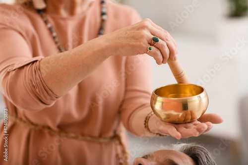 Reiki master working with p...