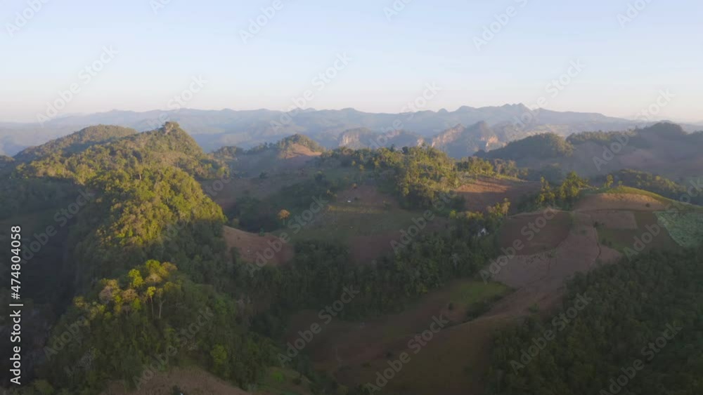 Aerial top view of forest trees and green mountain hills. Nature landscape background, Thailand. Aerial top view of forest trees and green mountain hills. Nature landscape background, Thailand.