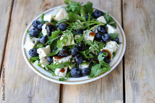 The best salad with blueberries, cheese and arugula.