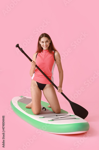 Sporty young woman with boa...