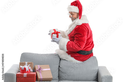 Santa Claus sitting on sofa...