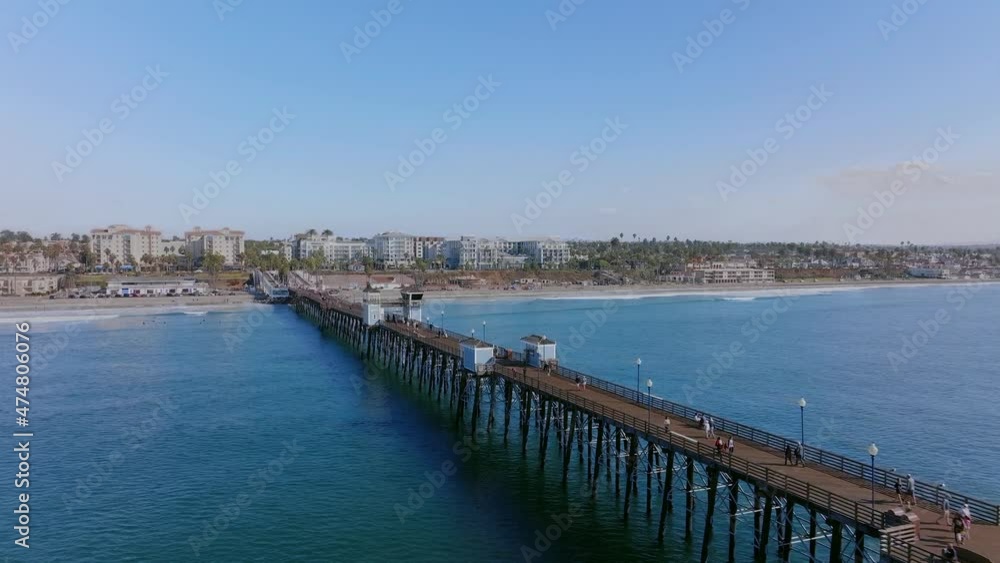 iconic and old Oceanside wooden pier at Southern California coastline, USA. Aerial view iconic and old Oceanside wooden pier at Southern California coastline, USA. Aerial view