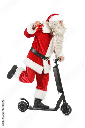 Santa Claus with Christmas bell and electric bike on white background