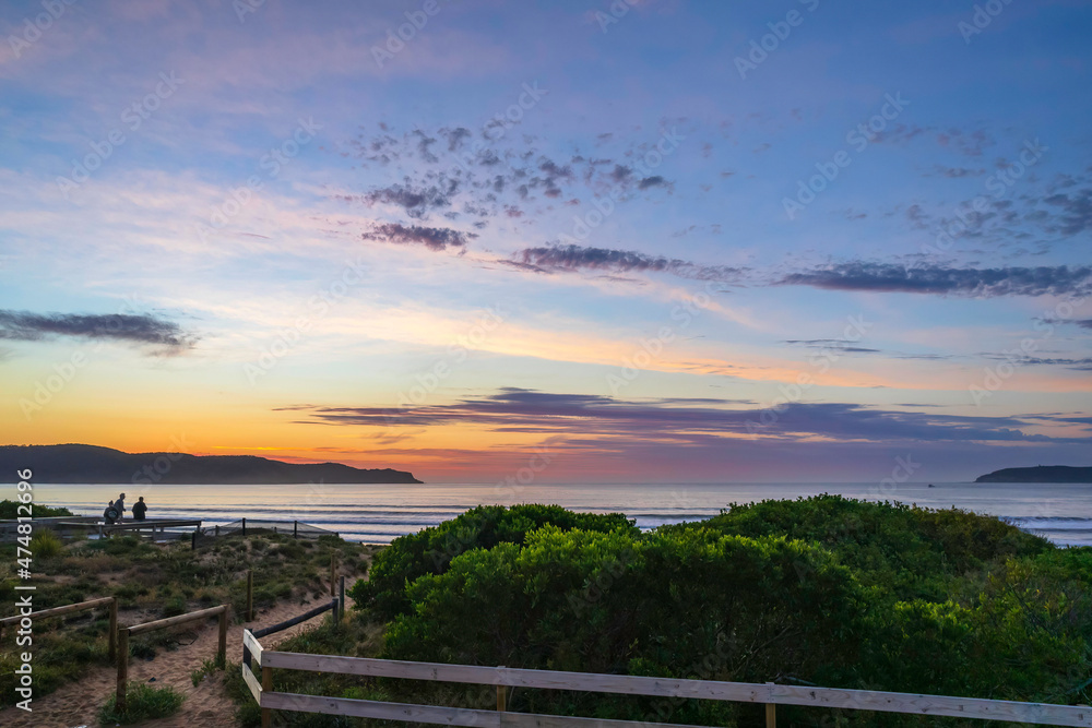 Sunrise seascape with a mix of high and medium clouds