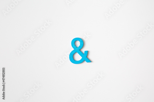 Blue wooden symbol "and" on white background