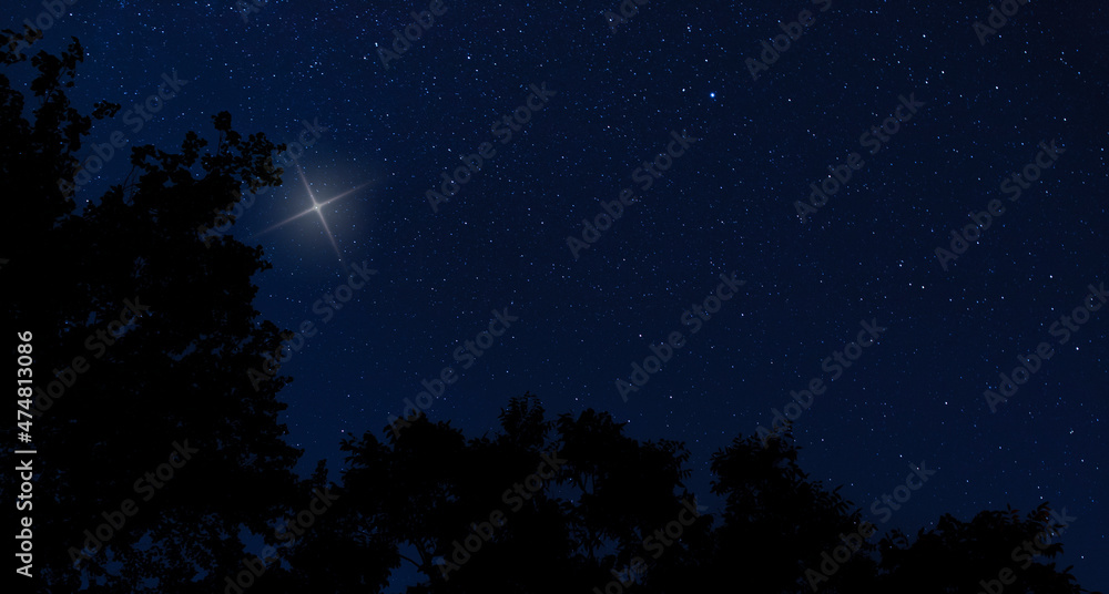 Naklejka premium Bright starry night with one glowing the most