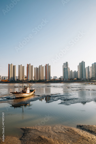 Wolgot port mud flat and apartment buildings in Siheung, Korea photo