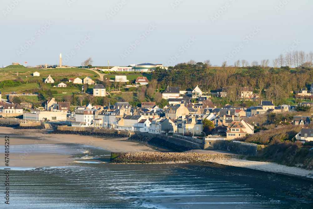 The town center of Arromanches les Bains and its beach at low tide in Europe, France, Normandy, Arromanches les Bains, in summer, on a sunny day.