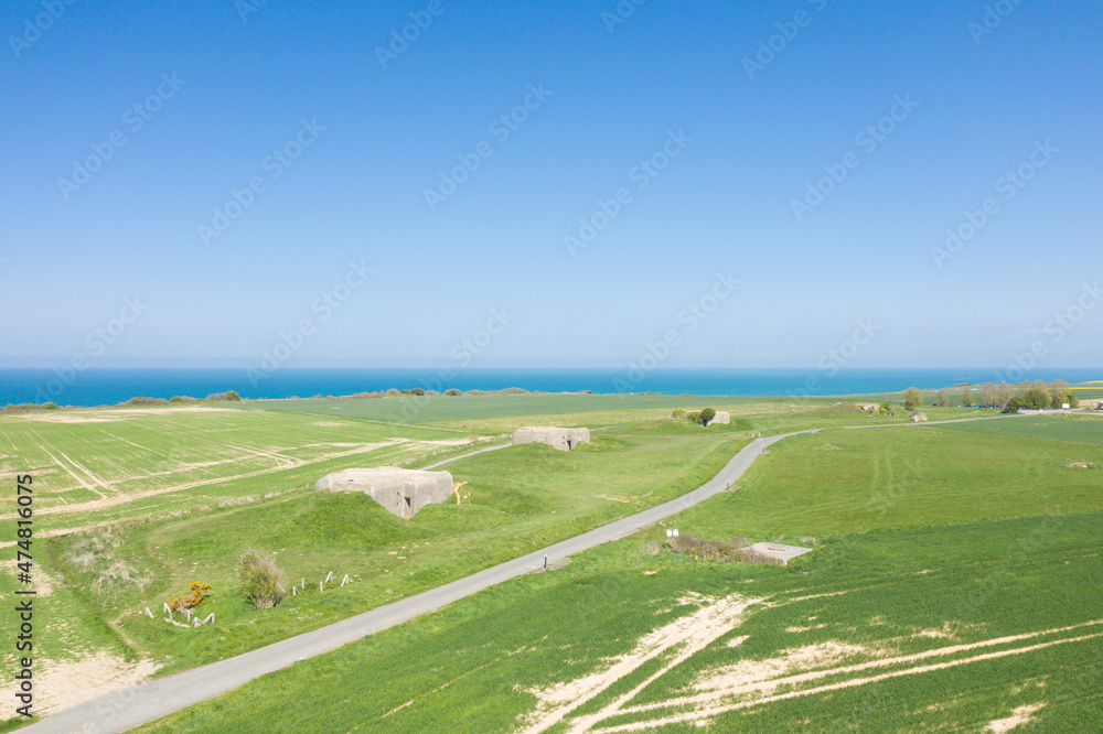A road in the middle of the Longues-sur-Mer battery facing the English Channel in Europe, France, Normandy, towards Arromanches, Longues sur Mer, in spring, on a sunny day.
