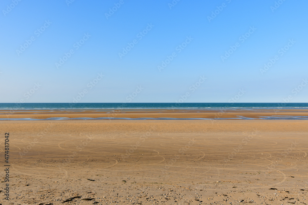Omaha beach facing the English Channel in Europe, France, Normandy, towards Arromanches, Colleville, in spring, on a sunny day. Omaha beach facing the English Channel in Europe, France, Normandy, towards Arromanches, Colleville, in spring, on a sunny day.