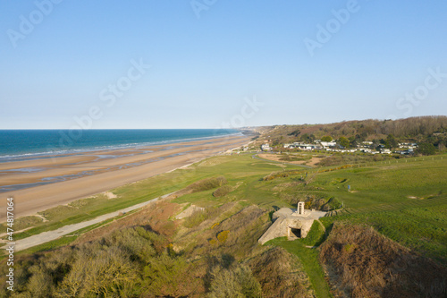 The panoramic view of WN62 fortifications from Omaha beach in Europe, France, Normandy, towards Arromanches, Colleville, in spring, on a sunny day. photo