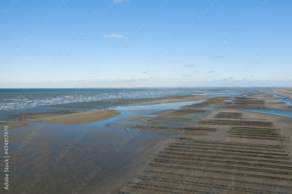 Obraz premium The panoramic view of the oyster park from Utah Beach in Europe, France, Normandy, towards Carentan, in spring, on a sunny day.
