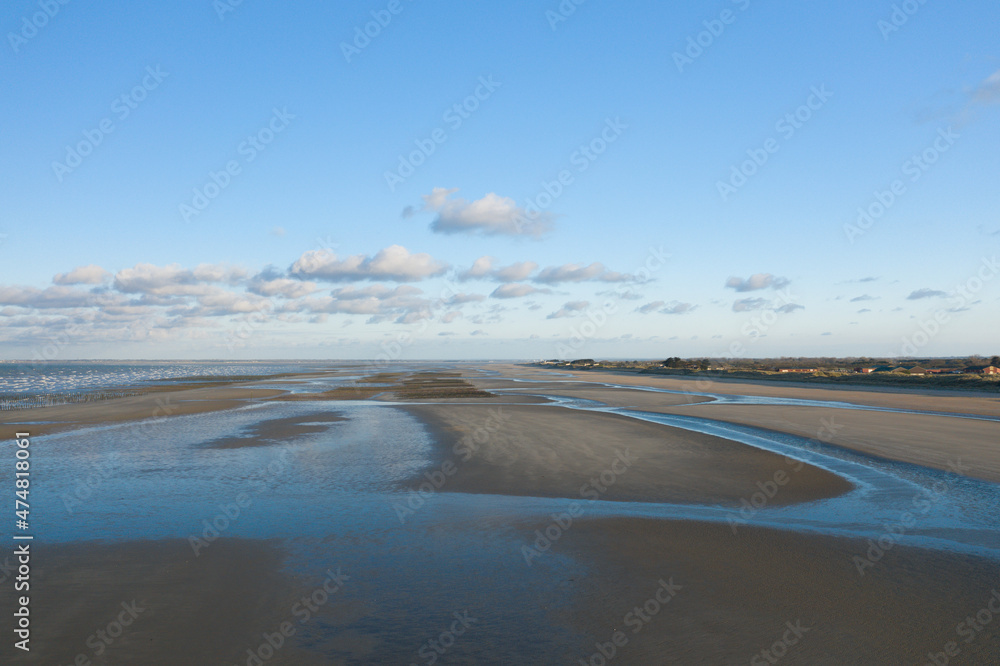 The fine sand beach of Utah Beach in Europe, France, Normandy, towards Carentan, in spring, on a sunny day. The fine sand beach of Utah Beach in Europe, France, Normandy, towards Carentan, in spring, on a sunny day.