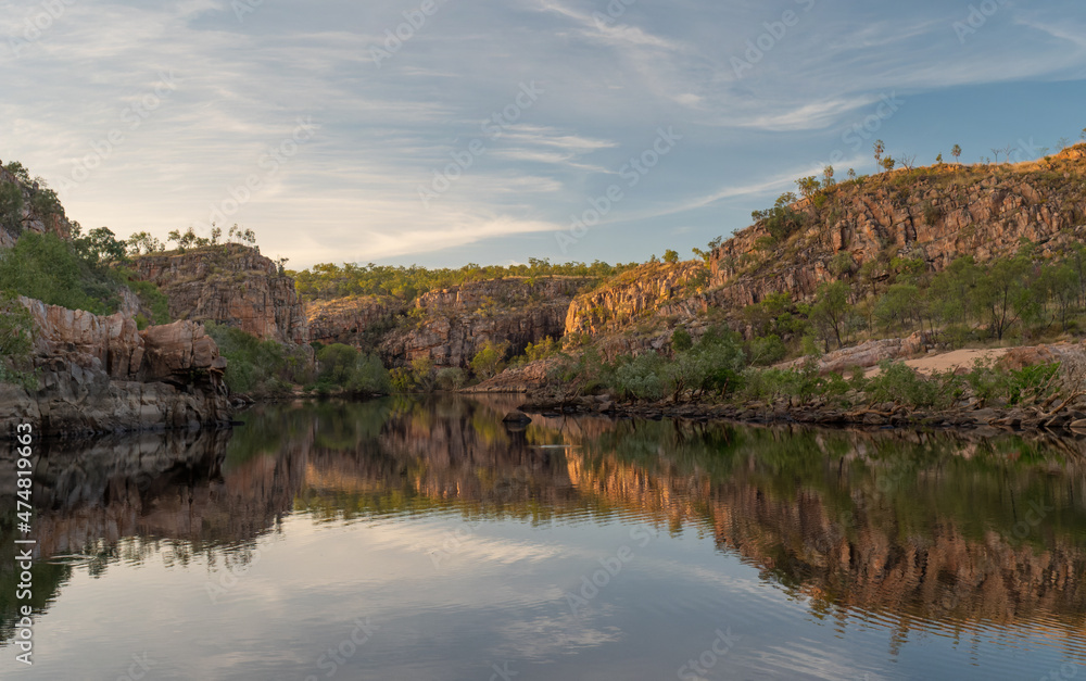 sunrise shot of reflections on the water of nitmiluk-katherine gorge at nitmiluk national park sunrise shot of reflections on the water of nitmiluk-katherine gorge at nitmiluk national park