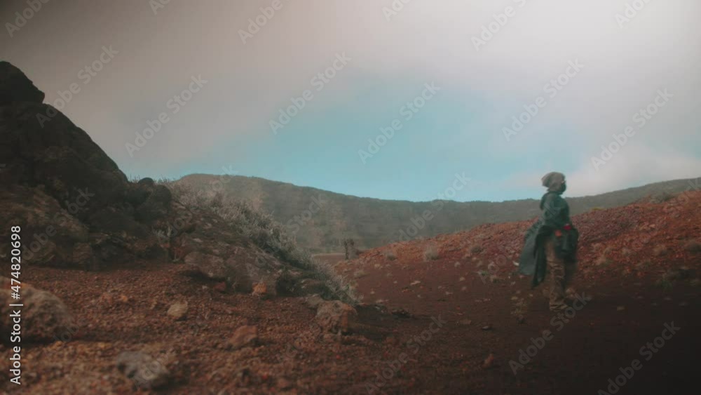 4k Person walking in red rocky desert 4k Person walking in red rocky desert