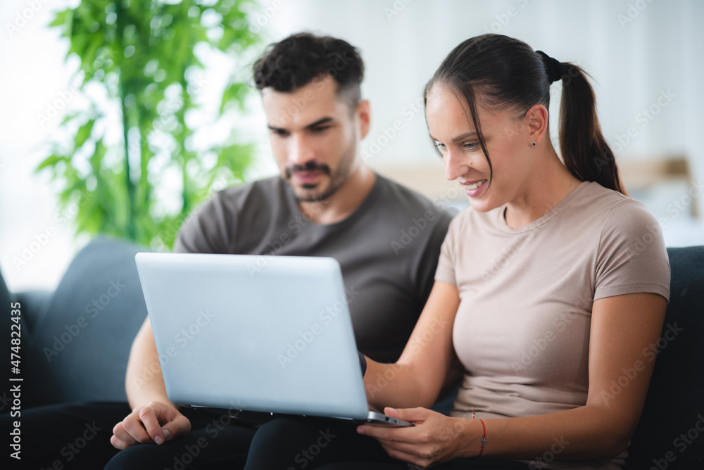 man and woman couple person are working together with laptop from home man and woman couple person are working together with laptop from home