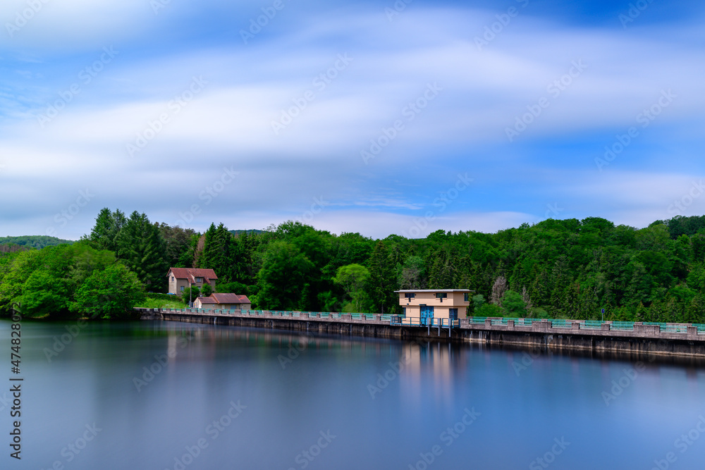 The Lac de Chaumecon dam on the lake in Europe, France, Burgundy, Nievre, Morvan, in summer on a sunny day.