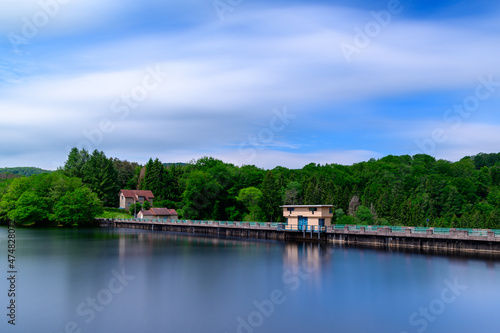The Lac de Chaumecon dam on the lake in Europe, France, Burgundy, Nievre, Morvan, in summer on a sunny day.