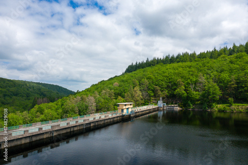 The Lac de Chaumecon dam in the middle of the countryside and forests in Europe, France, Burgundy, Nievre, Morvan, in summer, on a sunny day.