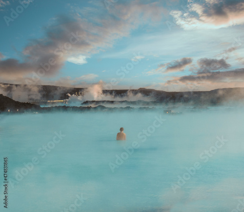 Woman inside the blue lagoon, surrounded by blue colors 