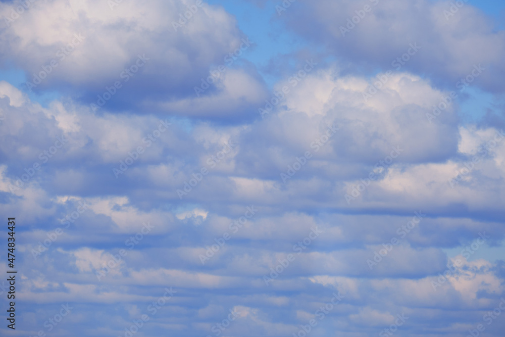 Background of many fluffy white clouds on the sky