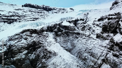 Drone Flight Over Edge Of Glacier Covered In Ice And Snow. Eyjafjallajokull In South Iceland At Winter. aerial photo