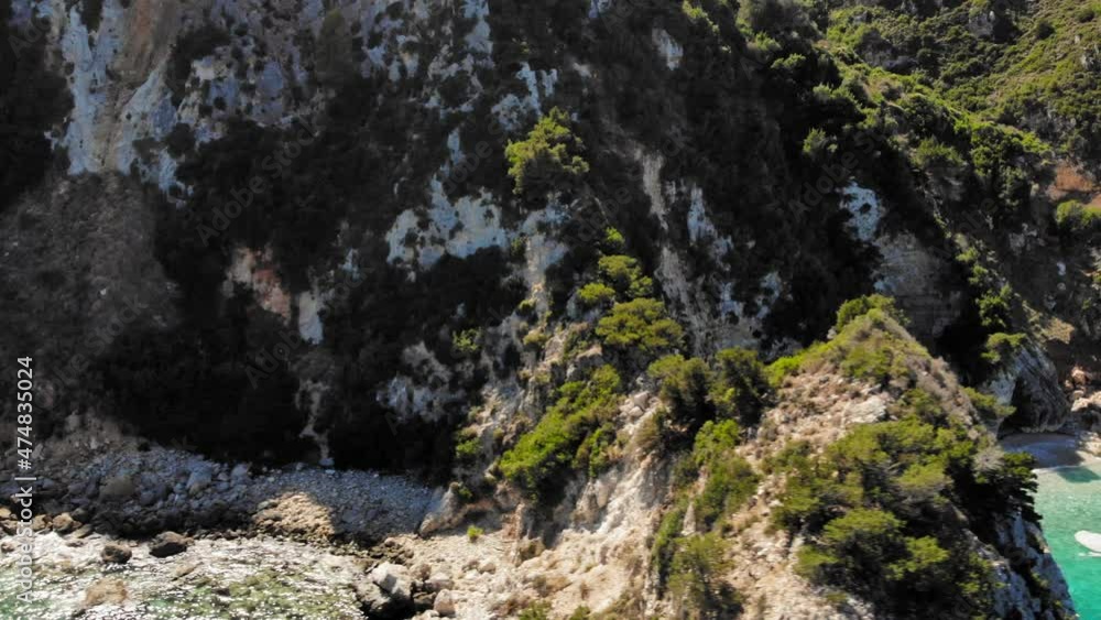Waves Crashing In The Shore Of Agia Eleni Beach in Kefalonia Greece - aerial shot Waves Crashing In The Shore Of Agia Eleni Beach in Kefalonia Greece - aerial shot