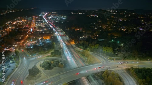 Scenic night city rush hour hyperlapse, California USA 4K footage. Night scene aerial Christmas eve traffic jam, people in a hurry for shopping before holidays vacation, winter season dark evening photo