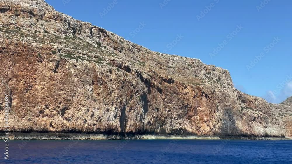 View from the sea to rocky coastline on Crete. View from the sea to rocky coastline on Crete.