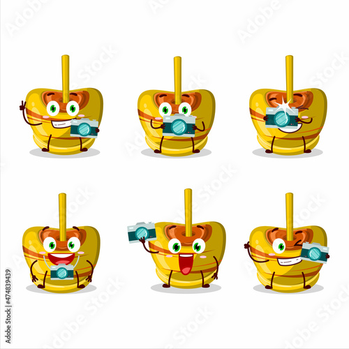 Photographer profession emoticon with yellow sugar candy cartoon character