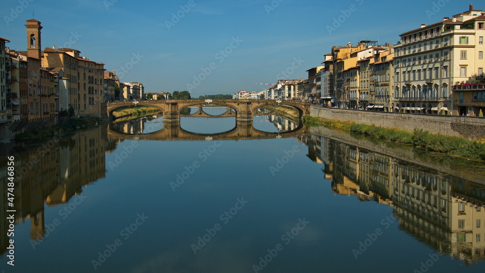 View of the bridge Ponte Santa Trinita over the river Arno from Ponte Vecchio in Florence, Italy, Europe
