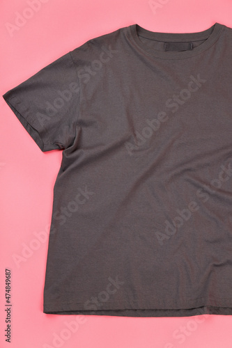 Dark t-shirt with space for print on pink background
