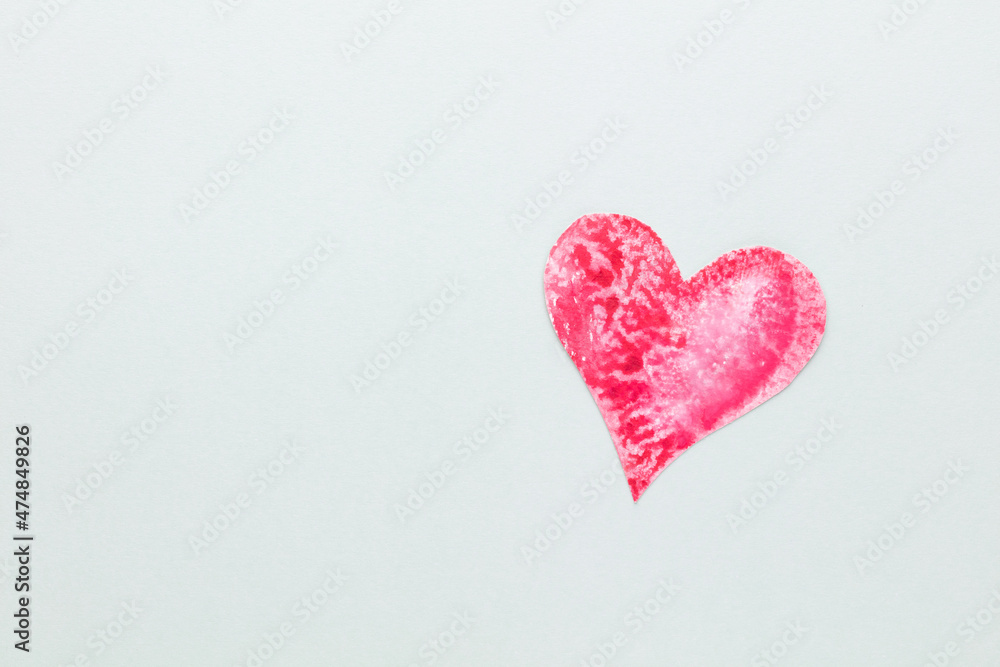 Obraz premium Cut the heart shaped paper, put on a pastel background.