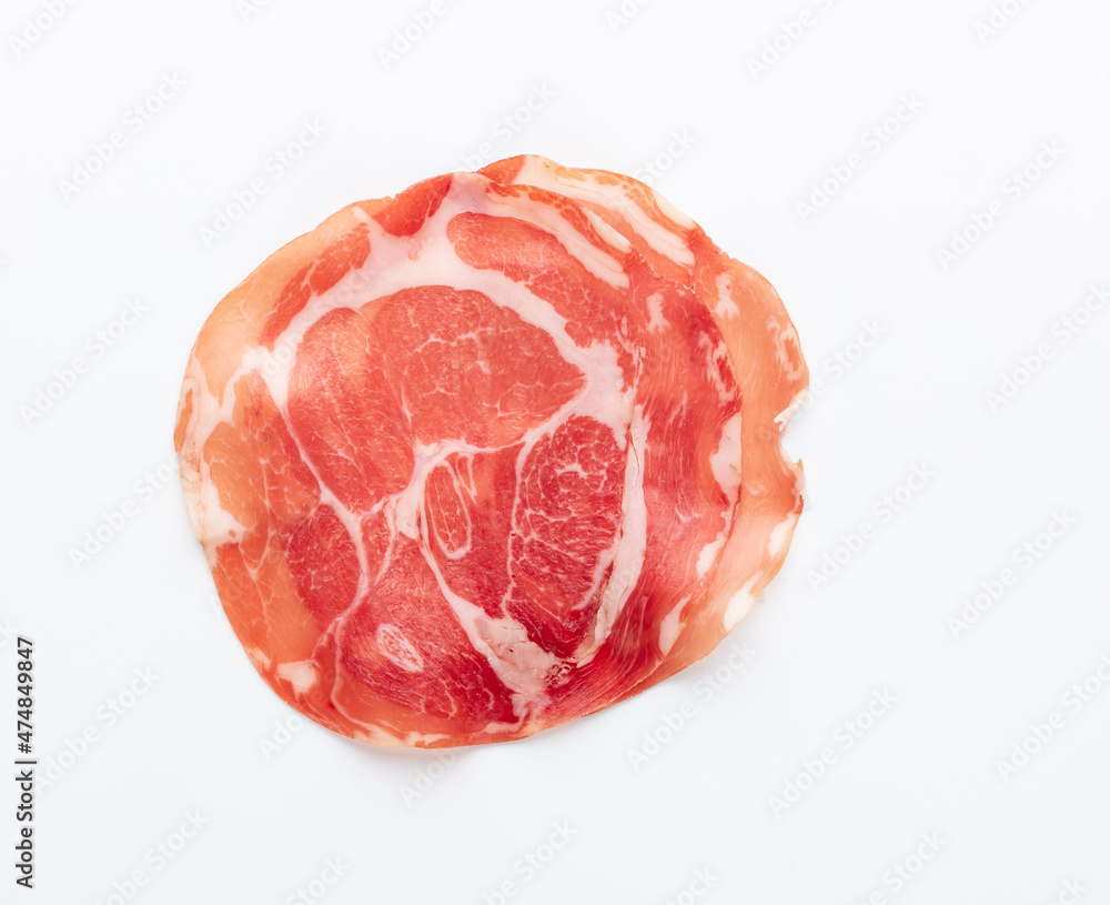 Italian prosciutto crudo or jamon. Raw ham. Isolated on white background. Italian prosciutto crudo or jamon. Raw ham. Isolated on white background.