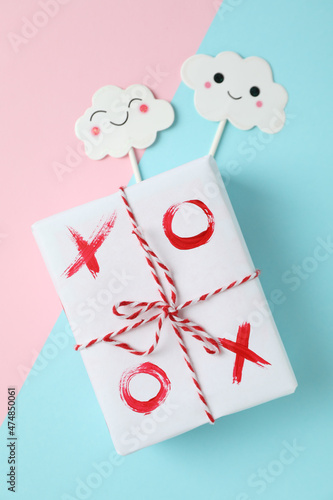 Gift box with XO on two tone background5 photo