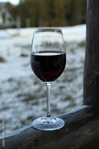Glass of wine outdoor in winter day