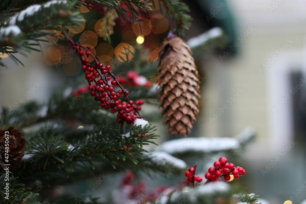 Obraz premium Happy New Year. Festive Christmas background. Christmas tree with Christmas lights covered in snow. Winter day in december