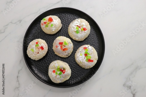 Rasmalai or Malai Sandwich, Roshmolai, Rasamalei is very popular Indian dessert. A sweet malai stuffing inside Rasgulla. It's a sweet delicacy made with Indian cottage cheese or chenna. Copy space.