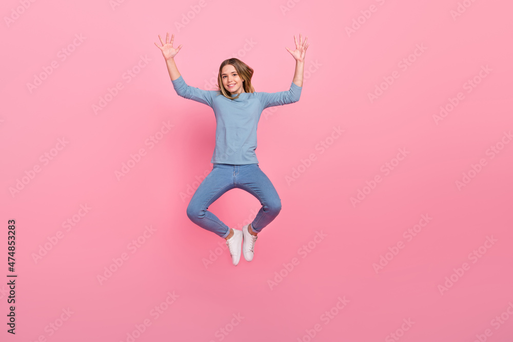 Full size photo of young cheerful lady have fun jumper show palms energetic isolated over pink color background