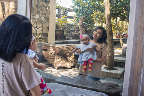 a mother and her baby daughter are hanging out