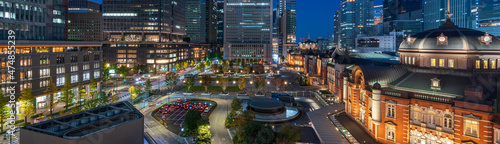 Banner head image of Tokyo station and business buildings at Magic Hour 
 photo