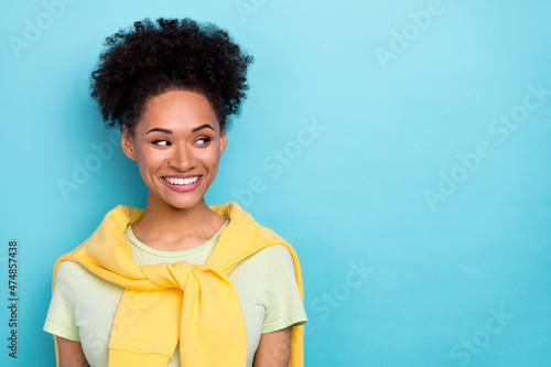 Photo of young pretty african woman wondered look empty space plan dreamy isolated over blue color background