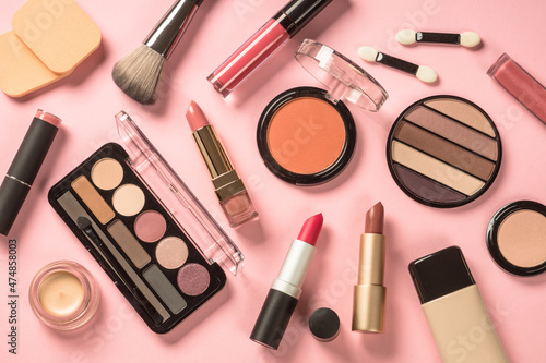 Beauty products. Make up products at pink background. Eye shadow, powder, lipstick for professional make up.