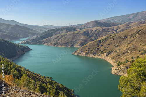 View over the Rules reservoir with the Rio Guadalfeo and the Rio Izbor in late afternoon light
