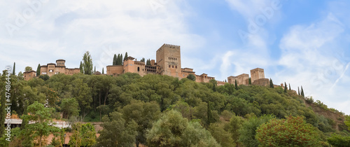 Full panoramic view at the Alhambra citadel, from Paseo de los Tristes, walk of the sad (The Promenade of the Sad), Granada, Spain photo