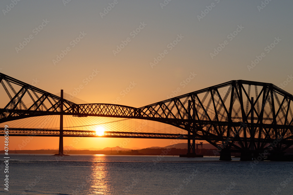 Sun setting behind Forth Rail and Road Bridges