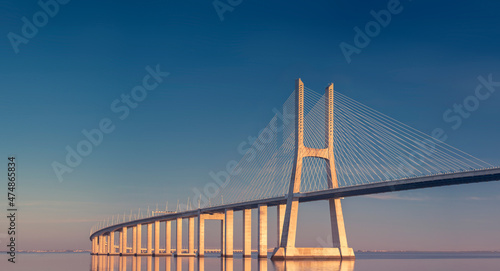 Vasco da Gama bridge at sunset in Lisbon, Portugal  photo