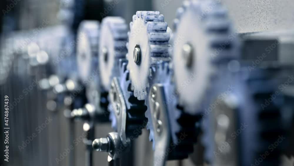 Close-up of steel gears spinning inside complex engine mechanism. Mechanics, teamwork, steampunk concept. Close-up of steel gears spinning inside complex engine mechanism. Mechanics, teamwork, steampunk concept.
