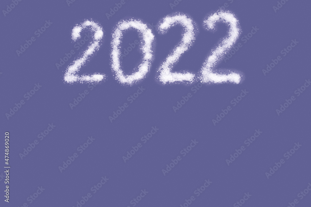 Happy new year 2022. Date 2022 written with salt like snow isolated on Color of the year 2022 Very Peri. Trending color 2022 Happy new year 2022. Date 2022 written with salt like snow isolated on Color of the year 2022 Very Peri. Trending color 2022