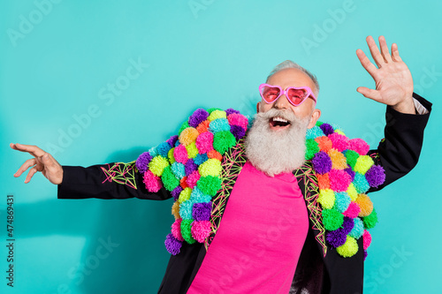 Billede på lærred Photo of funny excited mature guy dressed craft pom-pom jacket eyewear smiling d